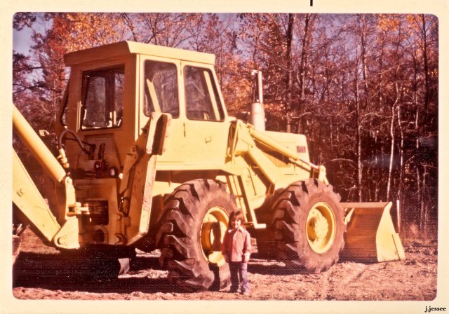 Judy in front of a tractor